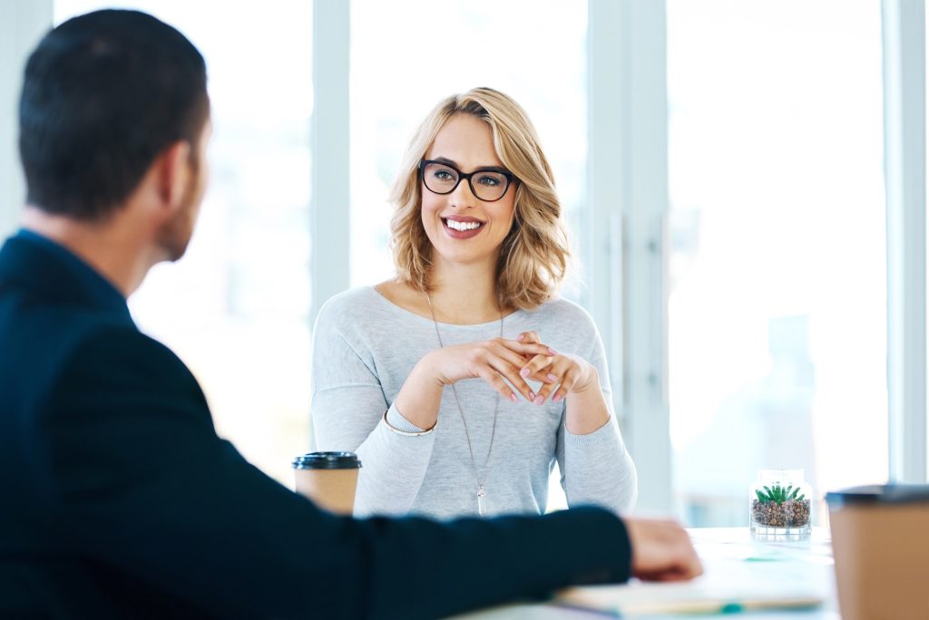 Confidence in the corporate world. Shot of two businesspeople having a meeting in an office.